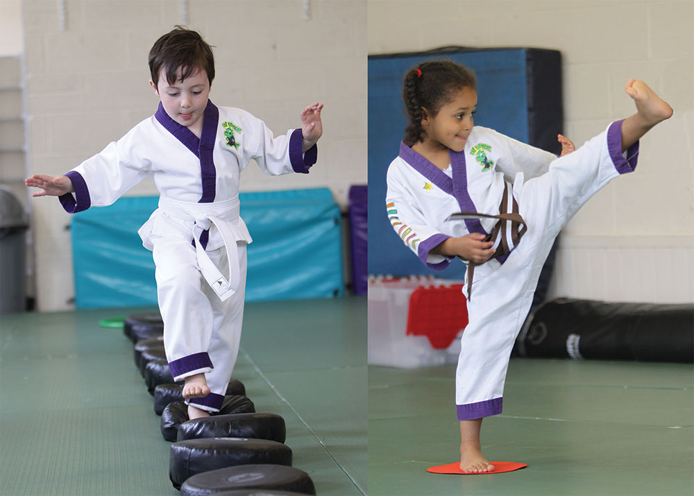Young boy and girl training in a martial arts class