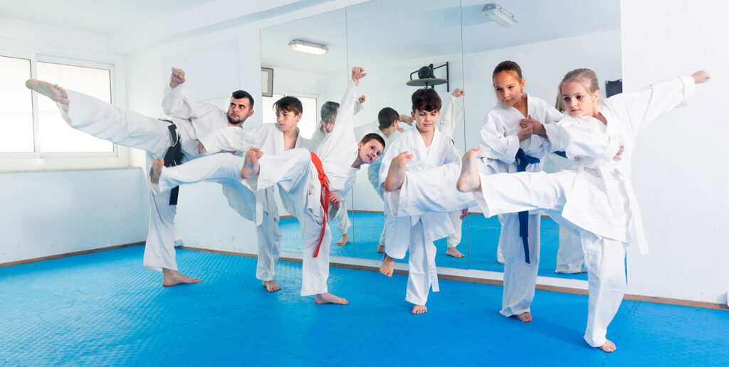 Martial arts class of different ages and grades