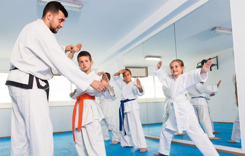 Coach correcting child using praise correct praise method